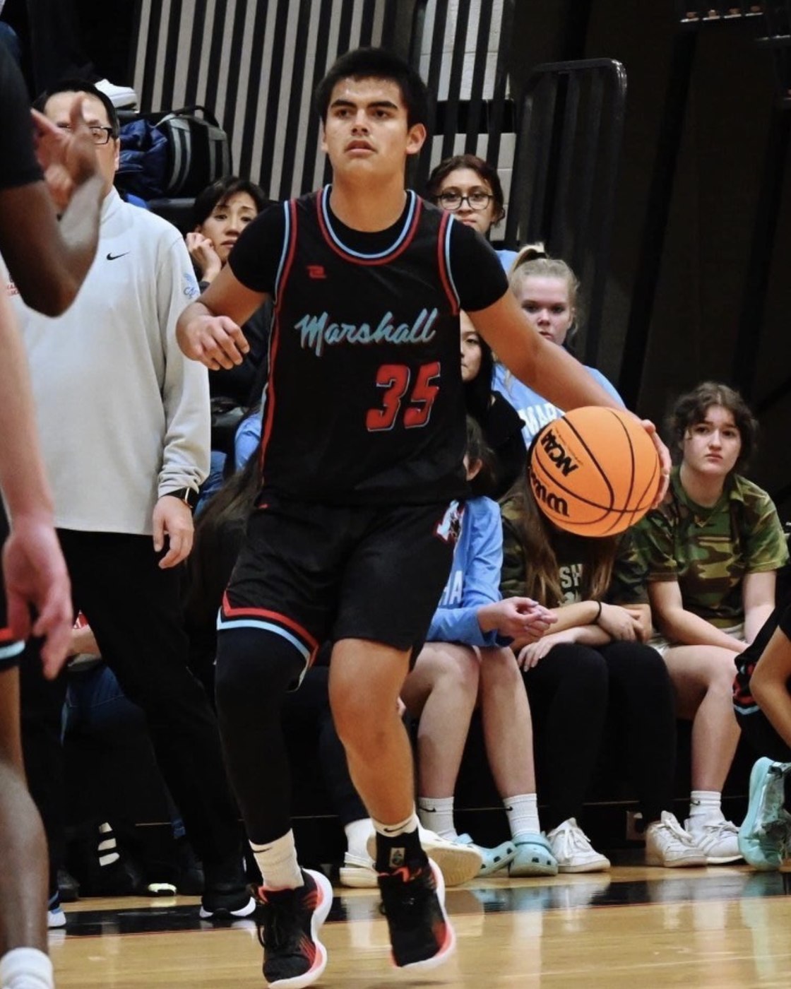 A Game-Time Skills athlete bringing the ball up in a high school game