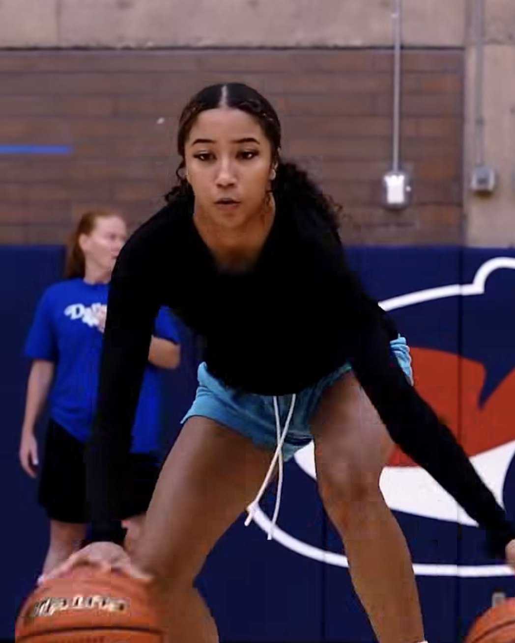 A Game-Time Skills athlete working through a two-ball handling drill